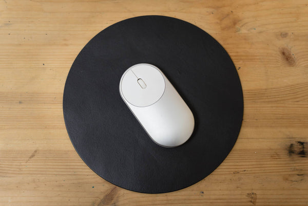 black round leather mouse pad