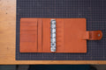 Organiseur de poche pour bagues en cuir grainé