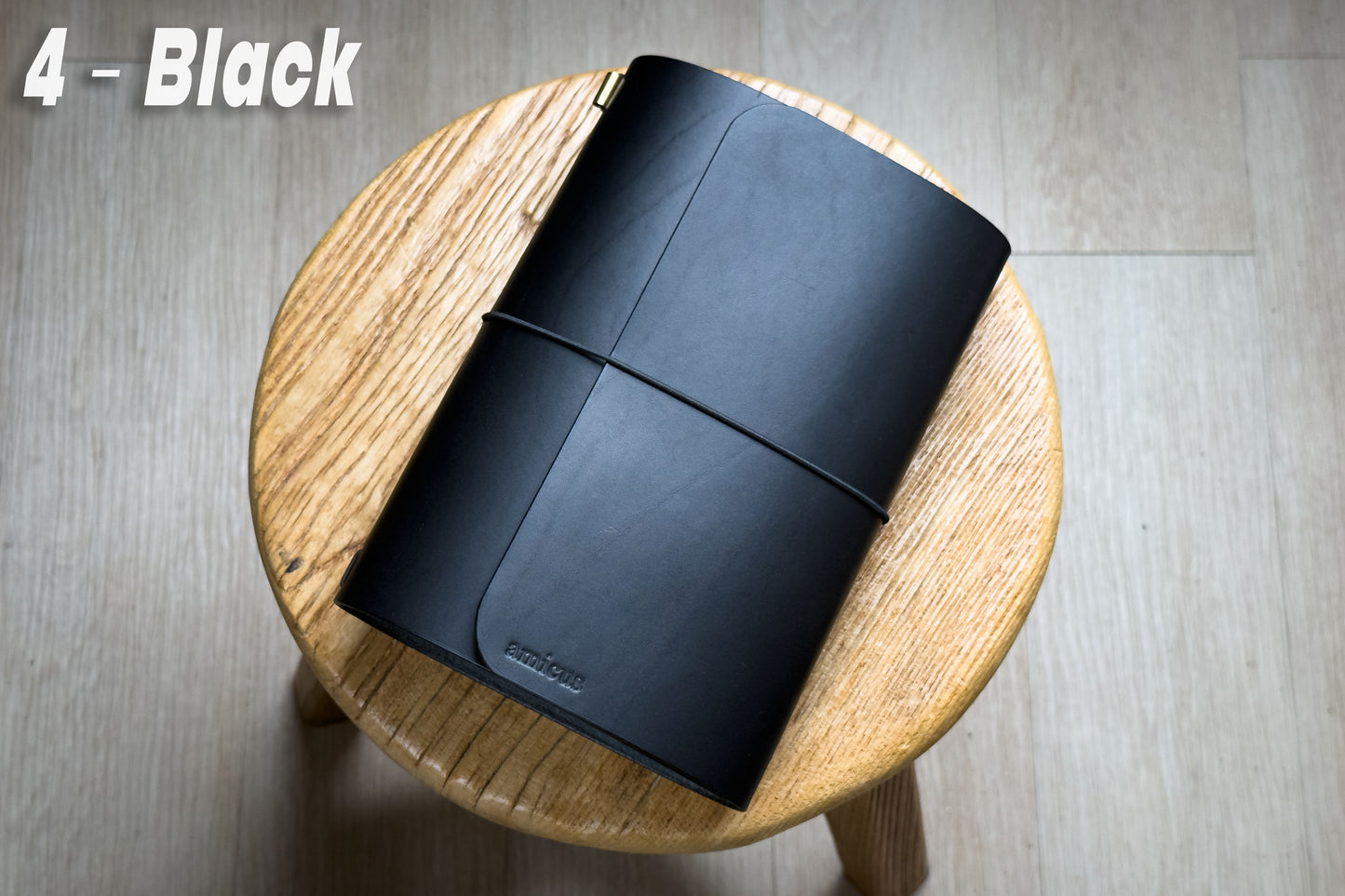 Black Buttero Leather Trifold Traveler's Notebook Cover with black elastic