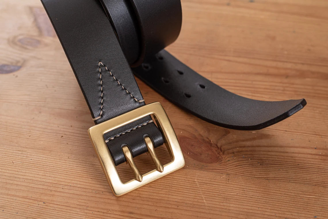 Black stitched double garrison belt - close-up solid brass buckle and belt tip