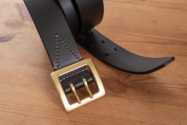 Black stitched double garrison belt - close-up solid brass buckle and belt tip