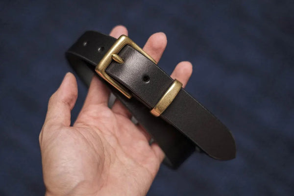 A black vegetable-tanned leather dress belt with a solid brass buckle and solid brass belt loop - front view - 30mm wide