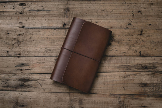 Brown Buttero Leather Trifold Traveler's Notebook Cover with brown elastic