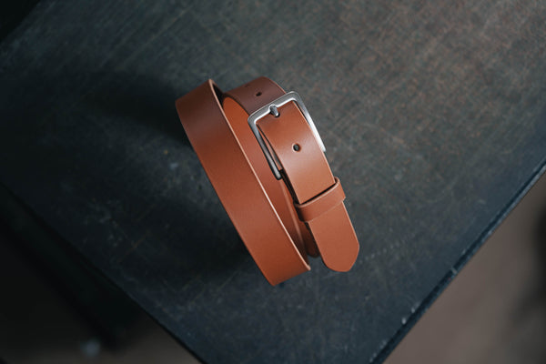 A brown vegetable-tanned leather SS buckle dress belt with a stainless steel buckle and leather belt loop and belt tip - Front view