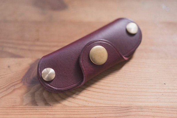Burgundy  leather key holder with brass snaps and screws