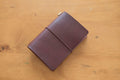Burgundy Buttero Leather Traveler's Notebook Cover with brown elastic