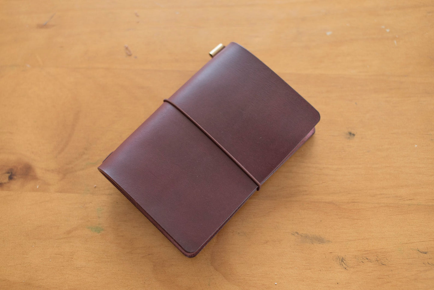 Burgundy Buttero Leather Traveler's Notebook Cover with brown elastic