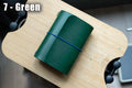 green Buttero Leather Trifold Traveler's Notebook Cover with blue elastic