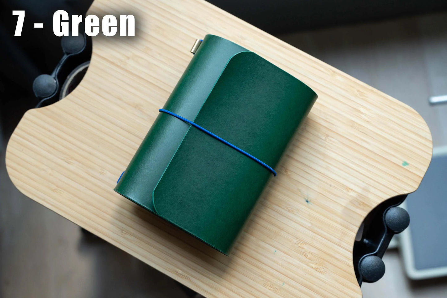 green Buttero Leather Trifold Traveler's Notebook Cover with blue elastic