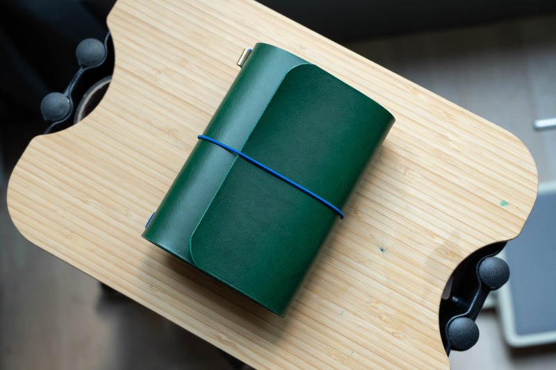 Green Buttero Leather Trifold Traveler's Notebook Cover with blue elastic
