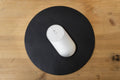black round leather mouse pad