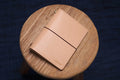 A natural Stitched Buttero Leather Traveler's Notebook and a elastic enclouse, displayed close