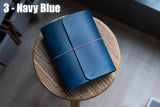Navy Blue Buttero Leather Trifold Traveler's Notebook Cover with pink elastic