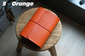 Orange Buttero Leather Trifold Traveler's Notebook Cover with red elastic