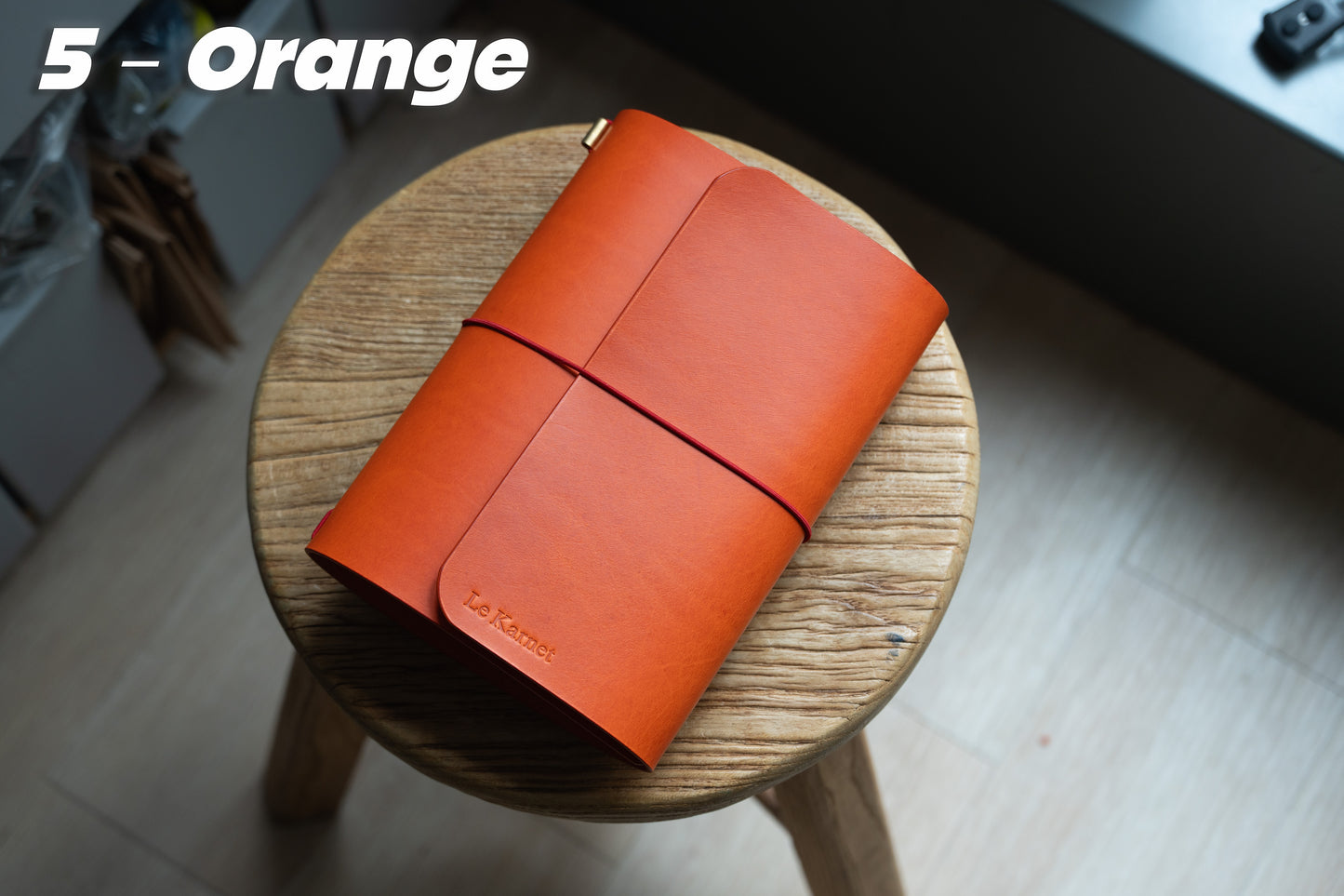 Orange Buttero Leather Trifold Traveler's Notebook Cover with red elastic