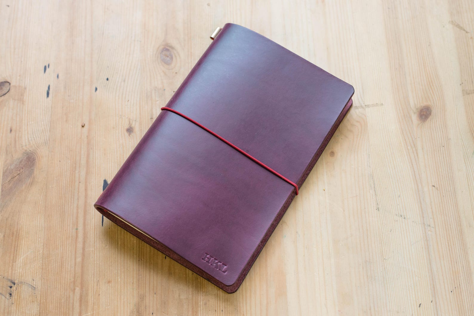 Purple Buttero Leather Traveler's Notebook Cover with red elastic
