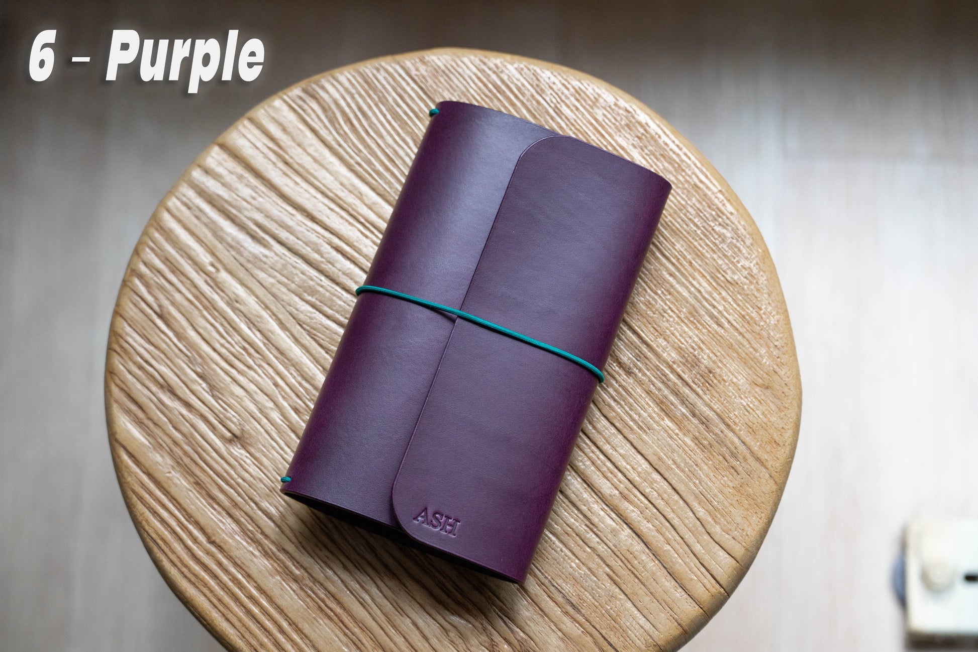 Purple Buttero Leather Trifold Traveler's Notebook Cover with green elastic