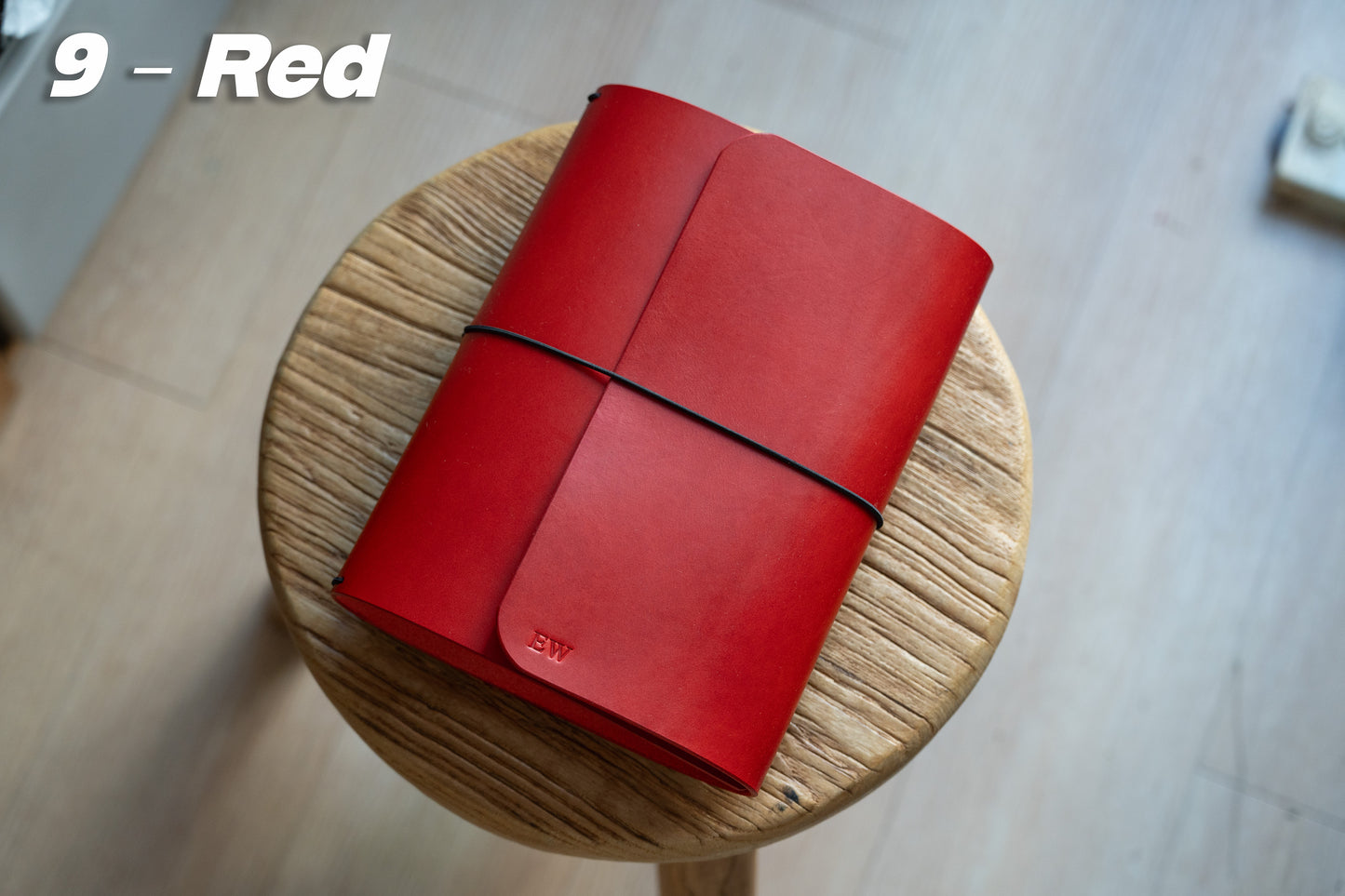 Red Buttero Leather Trifold Traveler's Notebook Cover with black elastic