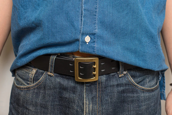 Person wearing a Stitched Double black Leather Garrison Belt with raw denim jeans - Lifestyle view