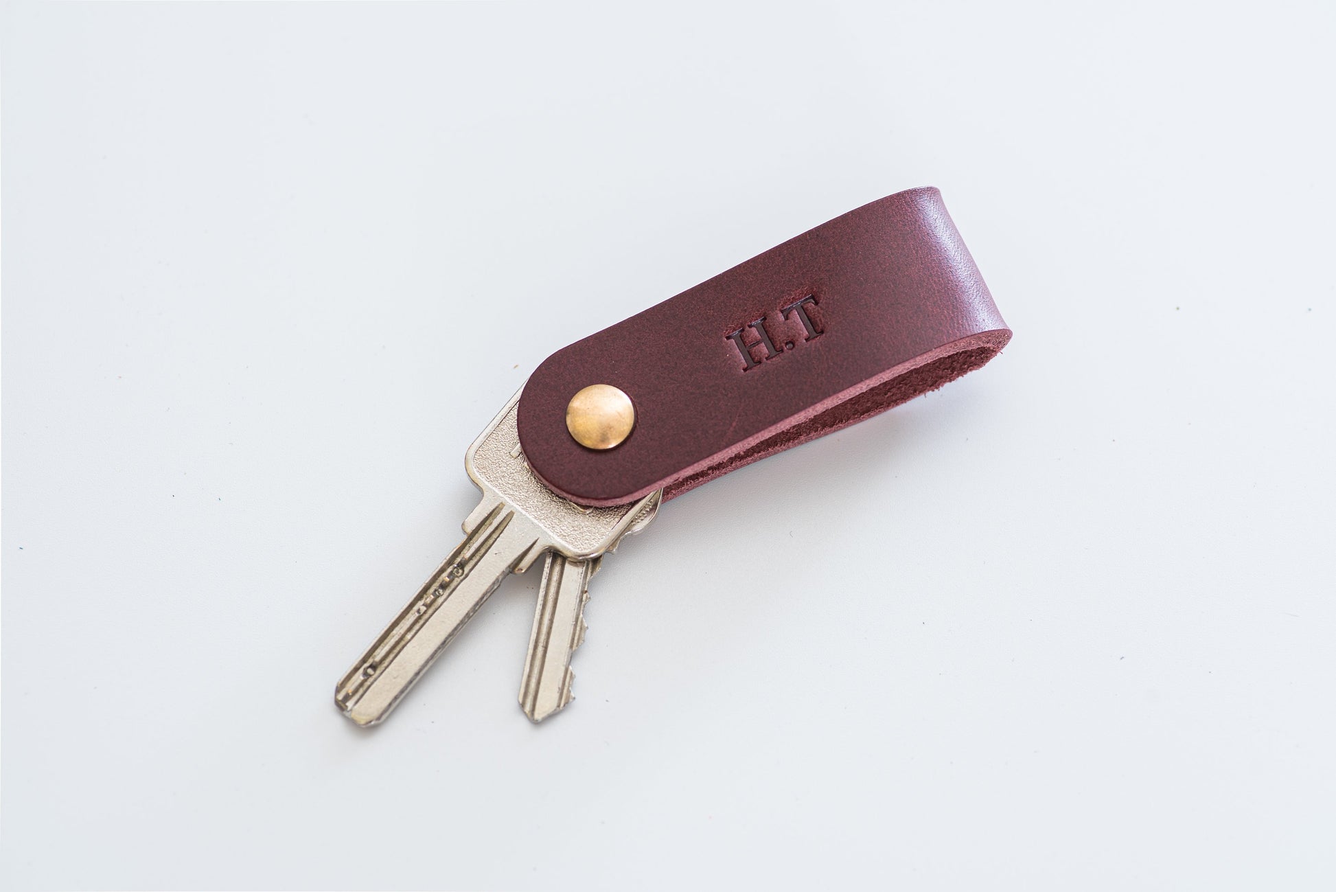 Burgundy Leather Swivel Key Holder with monogram and keys