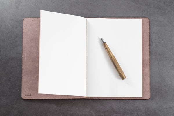 Buttero Leather Traveler's Notebook Cover with solid brass Fountain pen - Lifestyle view