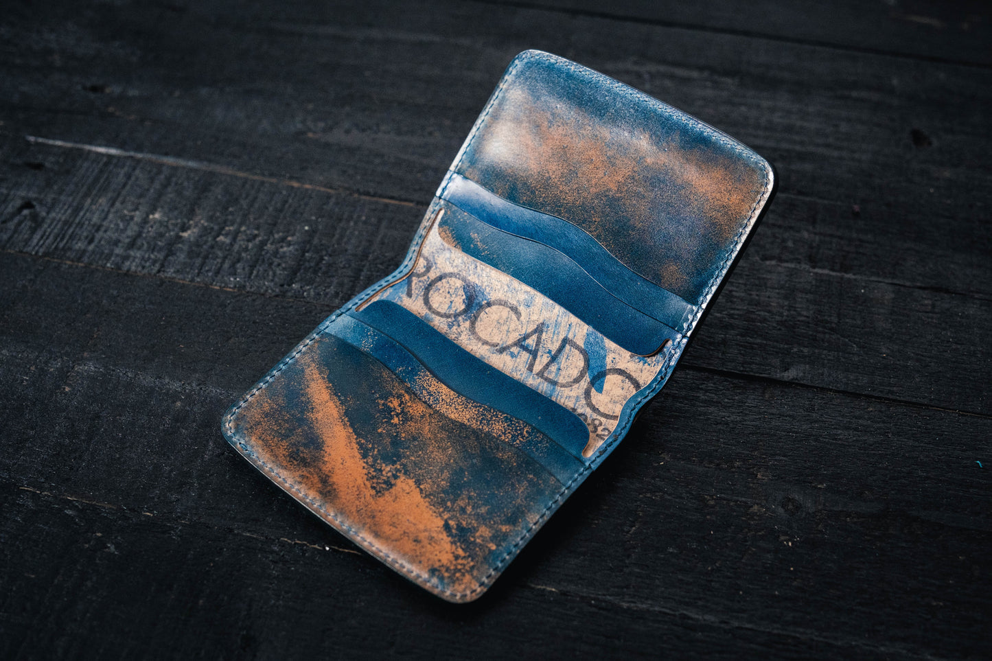 a blue Rocado Shell Cordovan Contour Billfold Wallet display opened