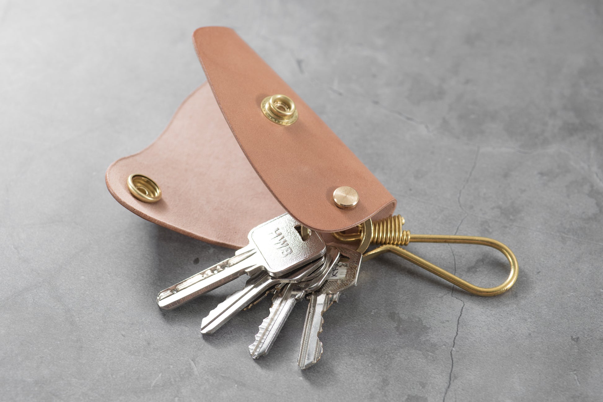 A natural Shell Cordovan leather key case with keys -Lifestyle view