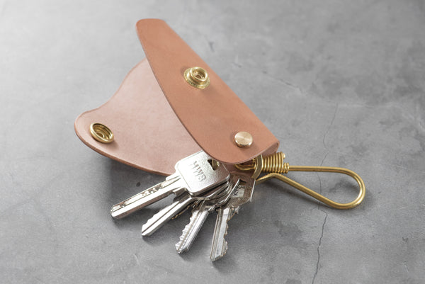 A natural Shell Cordovan leather key case with keys -Lifestyle view