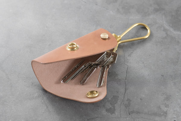 A natural Shell Cordovan leather key case with keys -Lifestyle view