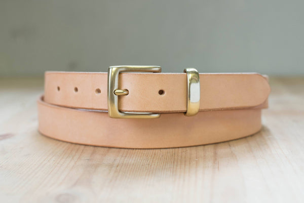 A natural vegetable-tanned leather dress belt with a solid brass buckle and solid brass belt loop - front view - 30mm wide