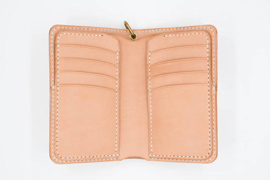 A natural leather wallet with multiple card slots and a snap closure. The wallet is open and empty.