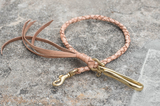 A round braid natural vegetable-tanned leather wallet rope with a solid brass hook 