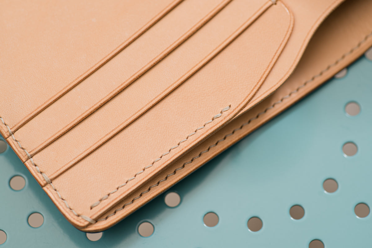 Close up card slot and the stitching inside 6-slot billfold wallet