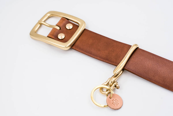 Solid Brass Fish Hook Key Holder matching with  a Tan Leather Garrison Belt - Lifestyle view