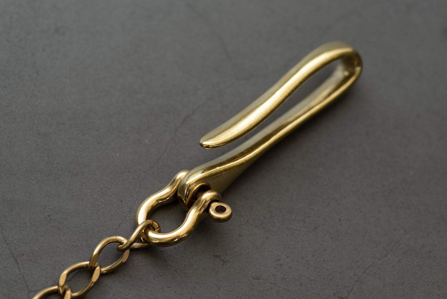 A solid brass wallet chain with a fish hook - close up for fish hook