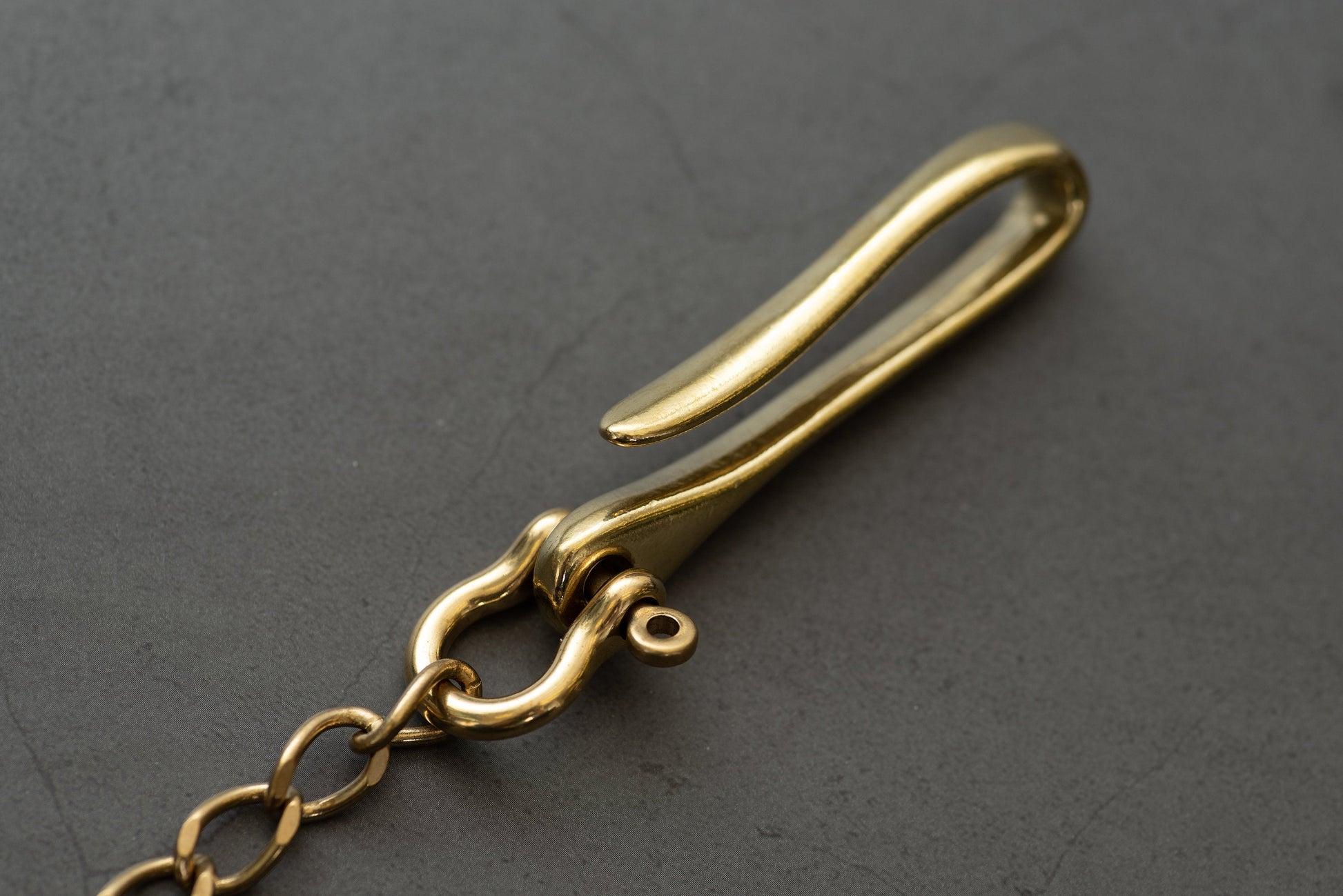 A solid brass wallet chain with a fish hook - close up for fish hook