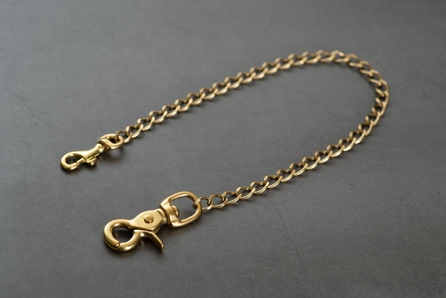 A solid brass wallet chain with a trigger snap